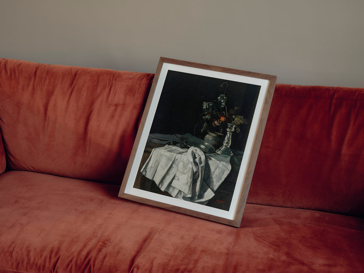 Still life with a white tablecloth and a silver candlestick